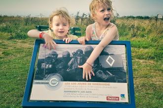 Children outside Arromanches 360 in Normandy